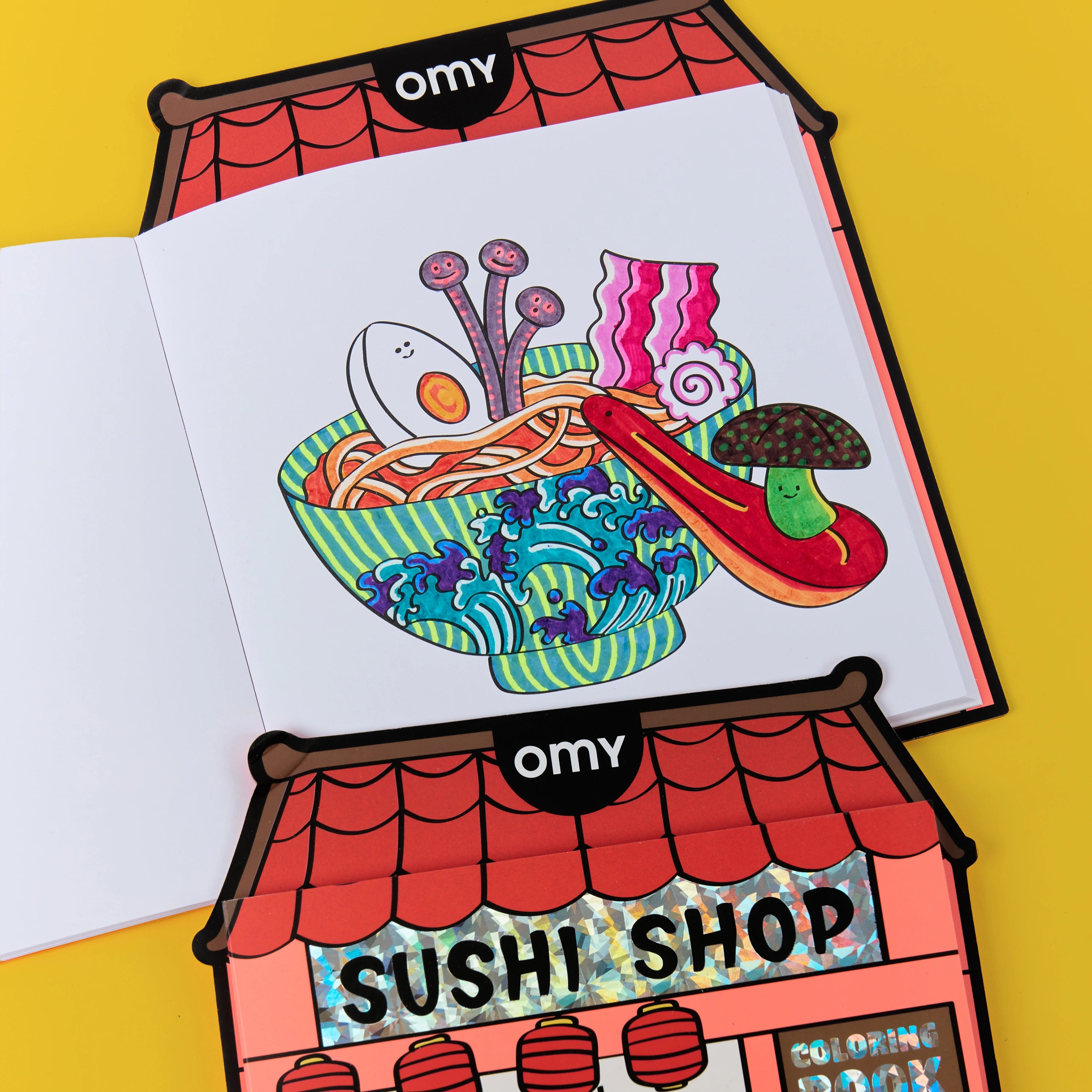 Enfant jouant avec la boutique géante à colorier « Sushi Shop » OMY.