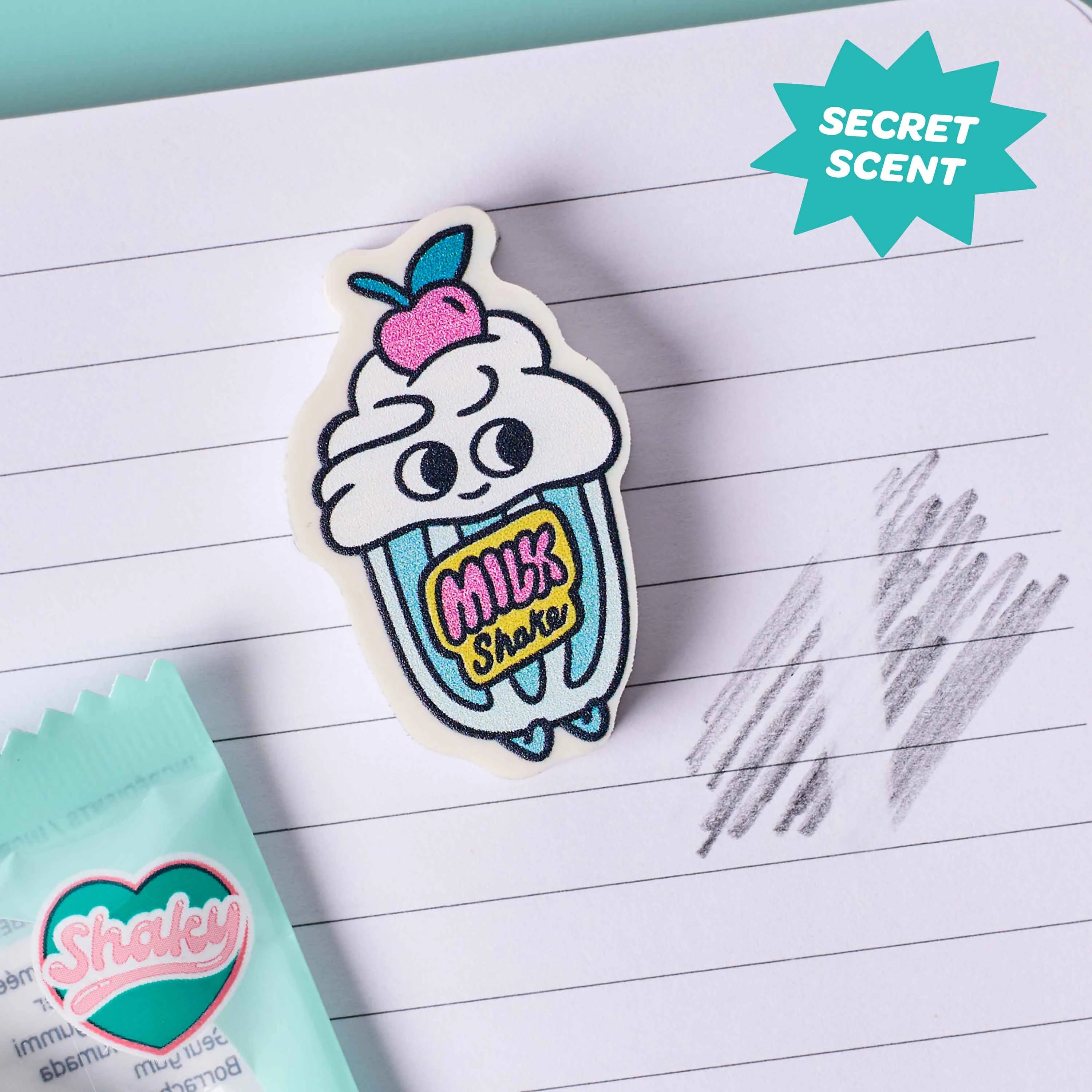 gomme parfumee enfant milkshake Shaky OMY sur cahier avec effet secret scent