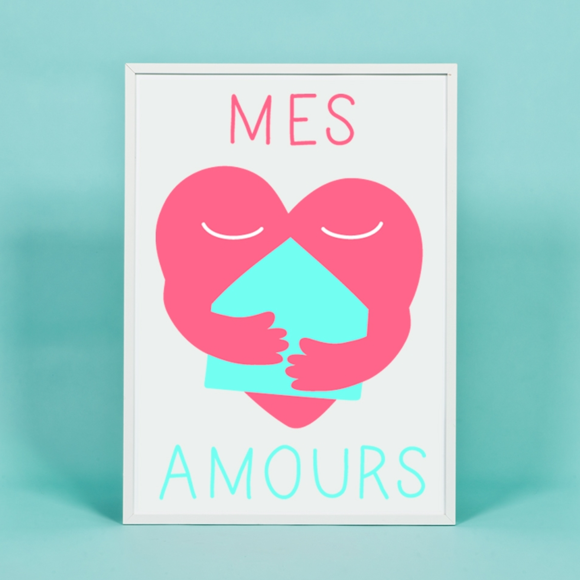 OMY Poster „Mes Amours“ in weißem Rahmen: rosa Herz, das ein türkisfarbenes Haus umarmt, auf türkisfarbenem Hintergrund
