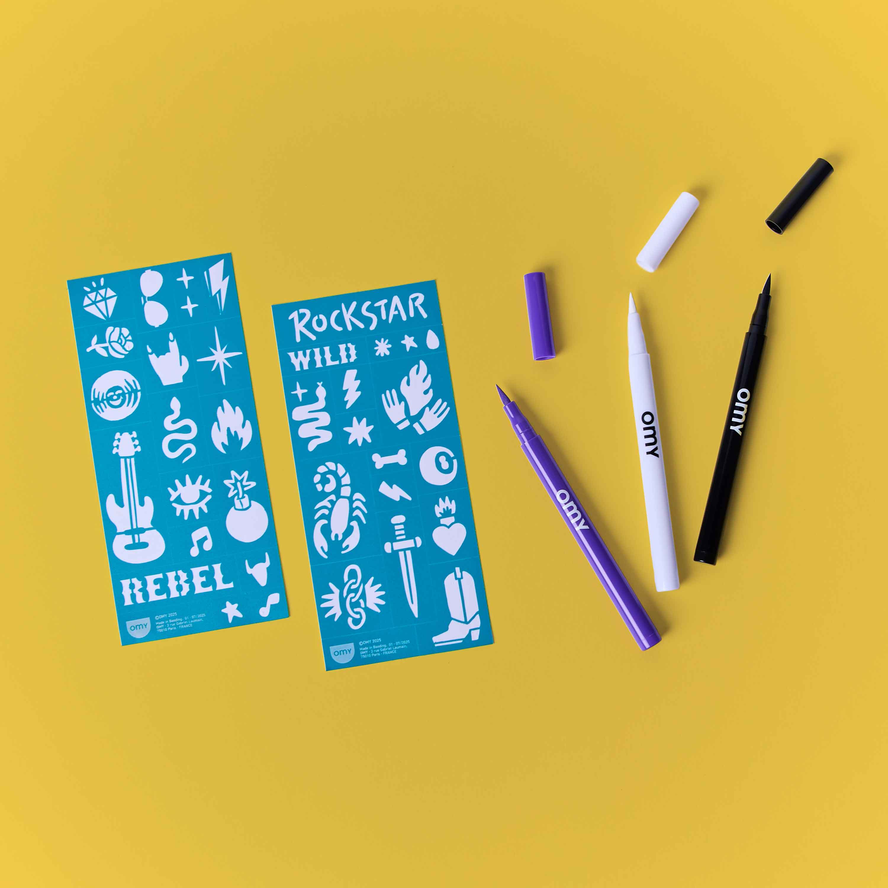 Contenu du kit Tattoo Art Rock Club OMY avec feutres tatouage temporaires et pochoirs rock