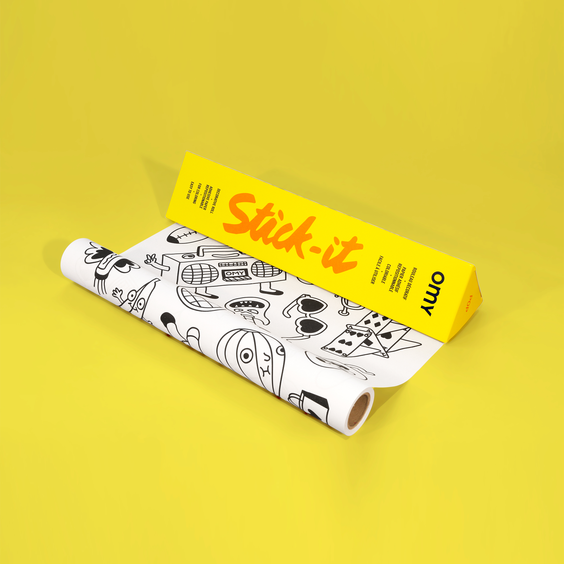 Rouleau de papier adhésif Stick-it POP OMY avec illustrations ludiques à colorier, idéal pour personnaliser objets et meubles.