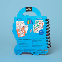 Back of the Dino OMY coloring book and sticker book shaped like a blue dinosaur: 35 pages to color, 2 pages of stickers and 5 wax crayons, ages 3 and up