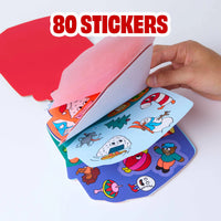 Sticker Activity Book Noël OMY aperto su più fogli con 80 sticker colorati a tema natalizio.