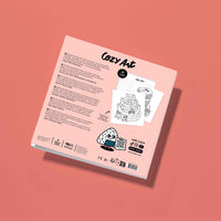 Back of the OMY Cozy Art Yummy coloring book, product information and notebook contents