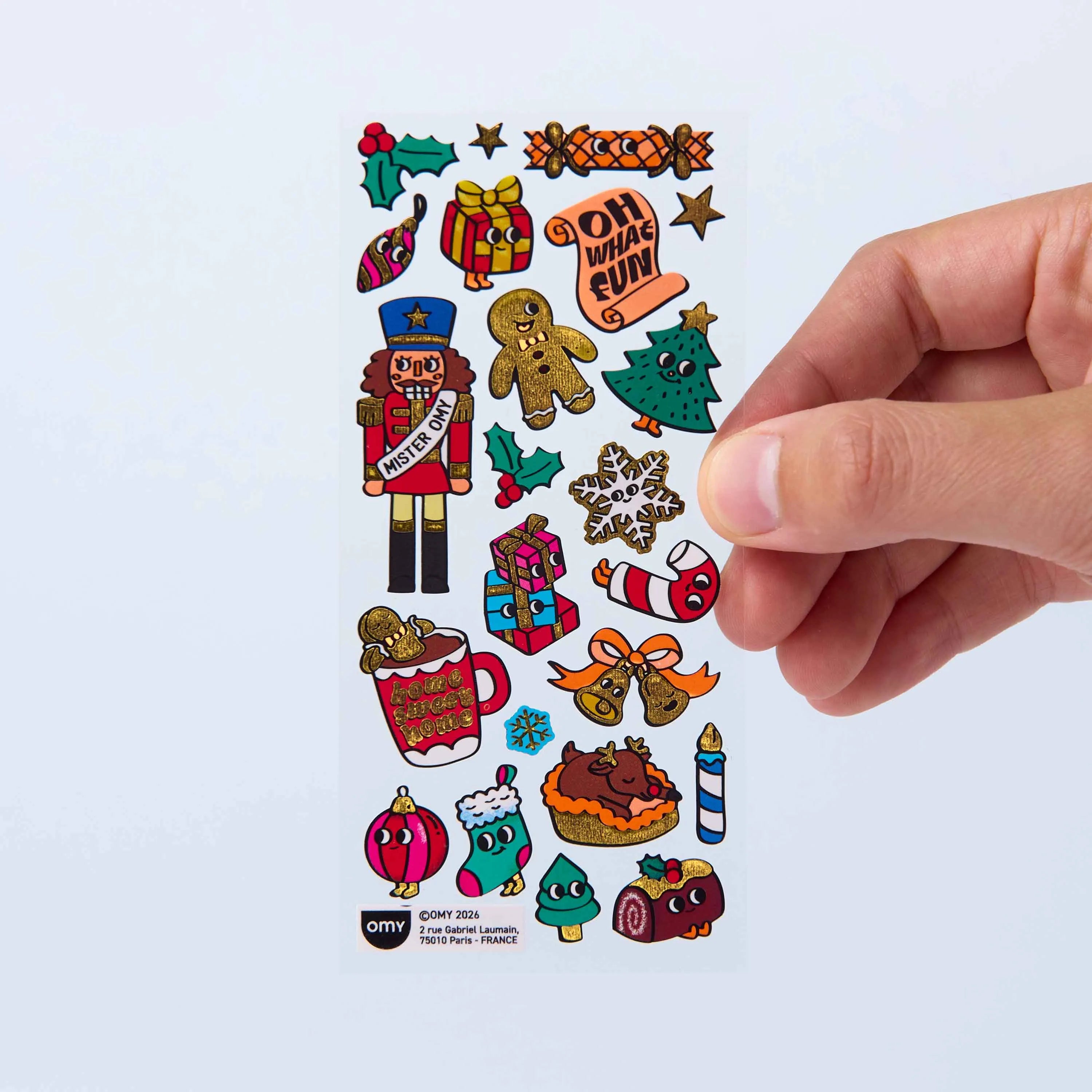 Planche de Fabulous Stickers Noël OMY avec casse-noisette, bonhomme en pain d’épices, sapin, cadeaux, flocon et décorations festives.
