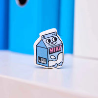 Packshot of the OMY Miky fancy eraser shaped like a milk brick, colorful and original design