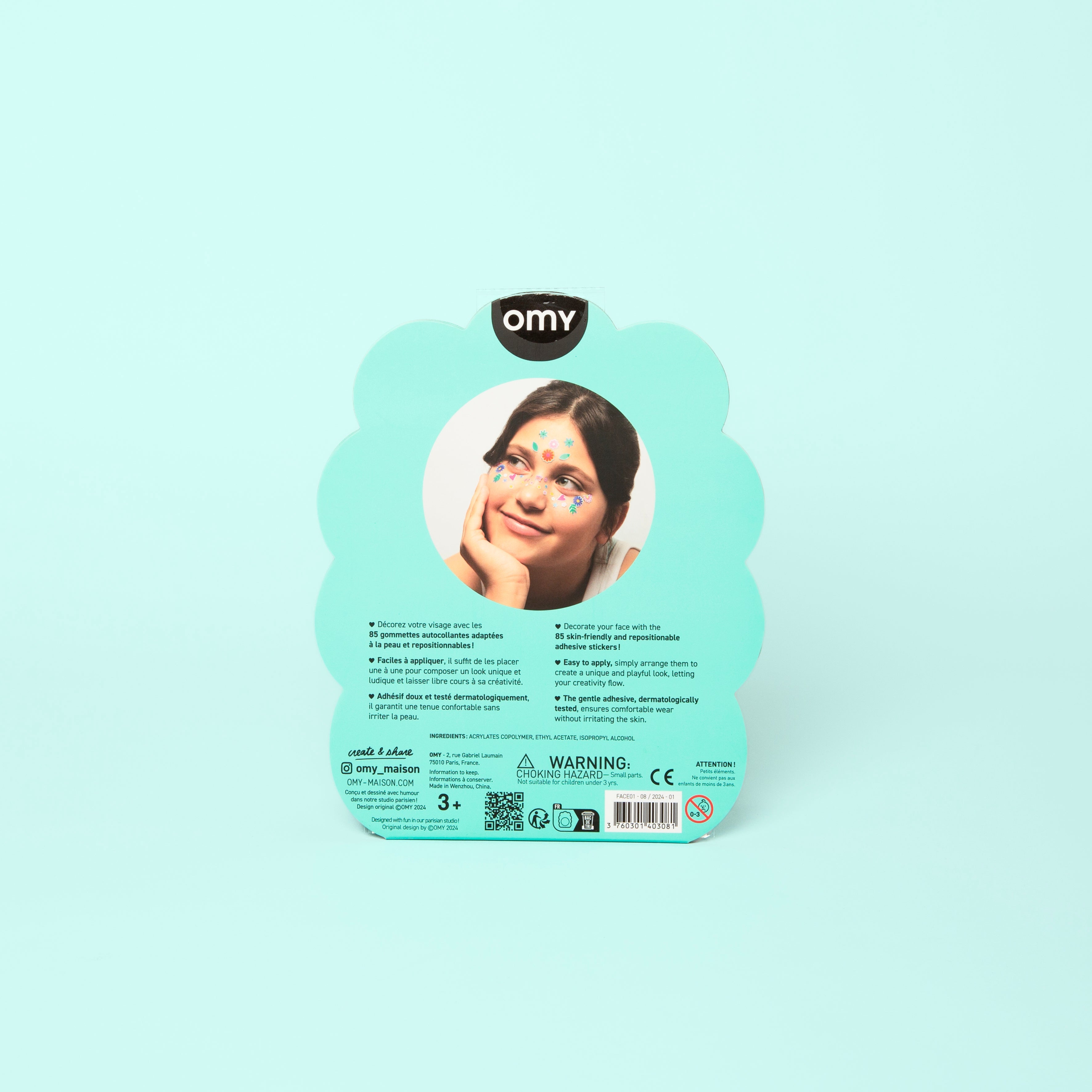 Dos de l'emballage vert d'eau des Face Stickers Flower OMY en forme de fleur, avec photo d'une enfant portant les stickers