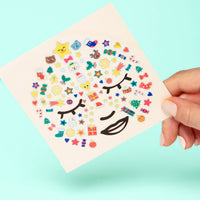 Planche de stickers pour le visage OMY sur le thème de noël, motifs festifs et colorés adaptés aux enfants
