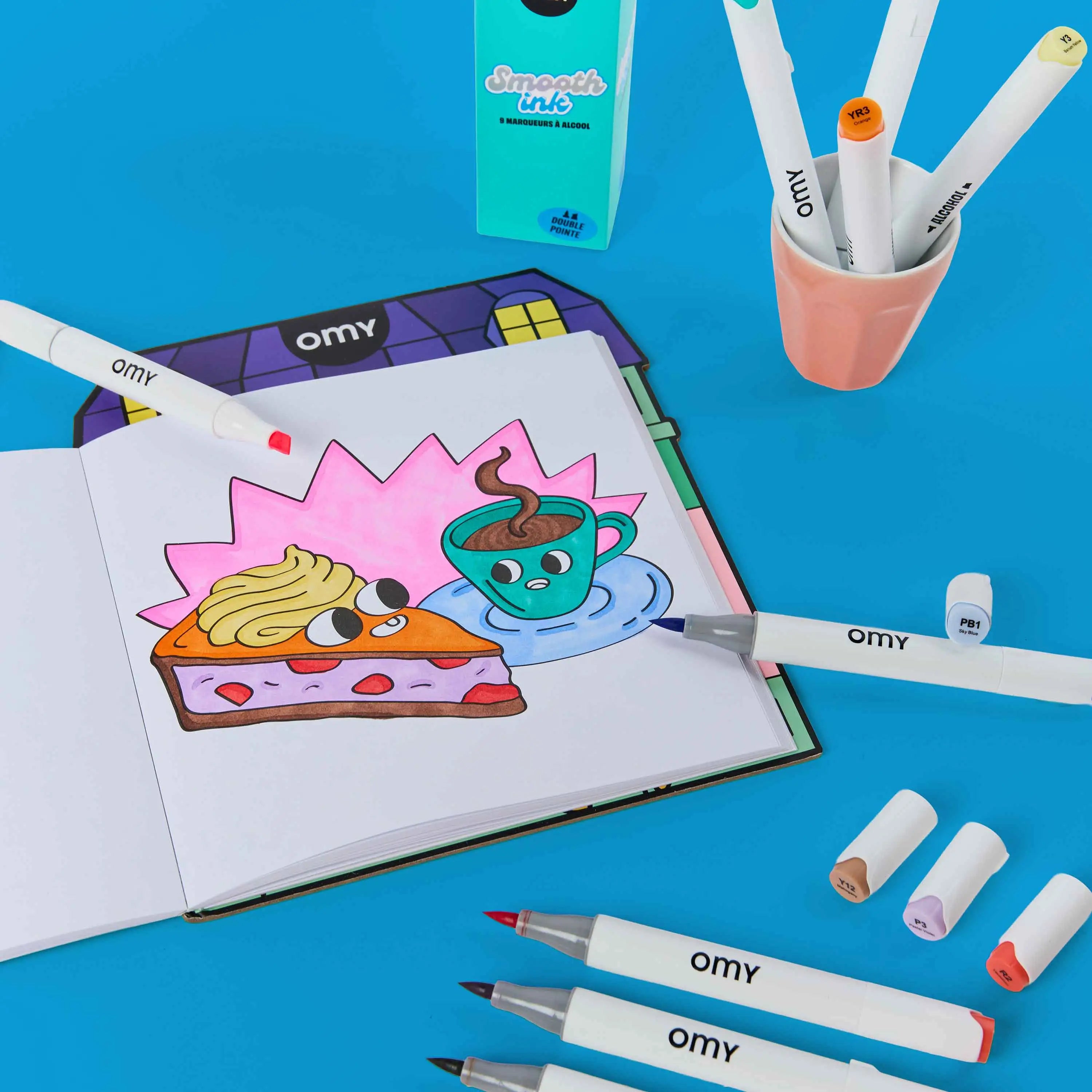 Feutres OMY utilisés pour illustrer et colorier des dessins.