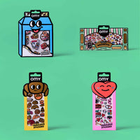 Four OMY Fabulous Stickers packages on a green background