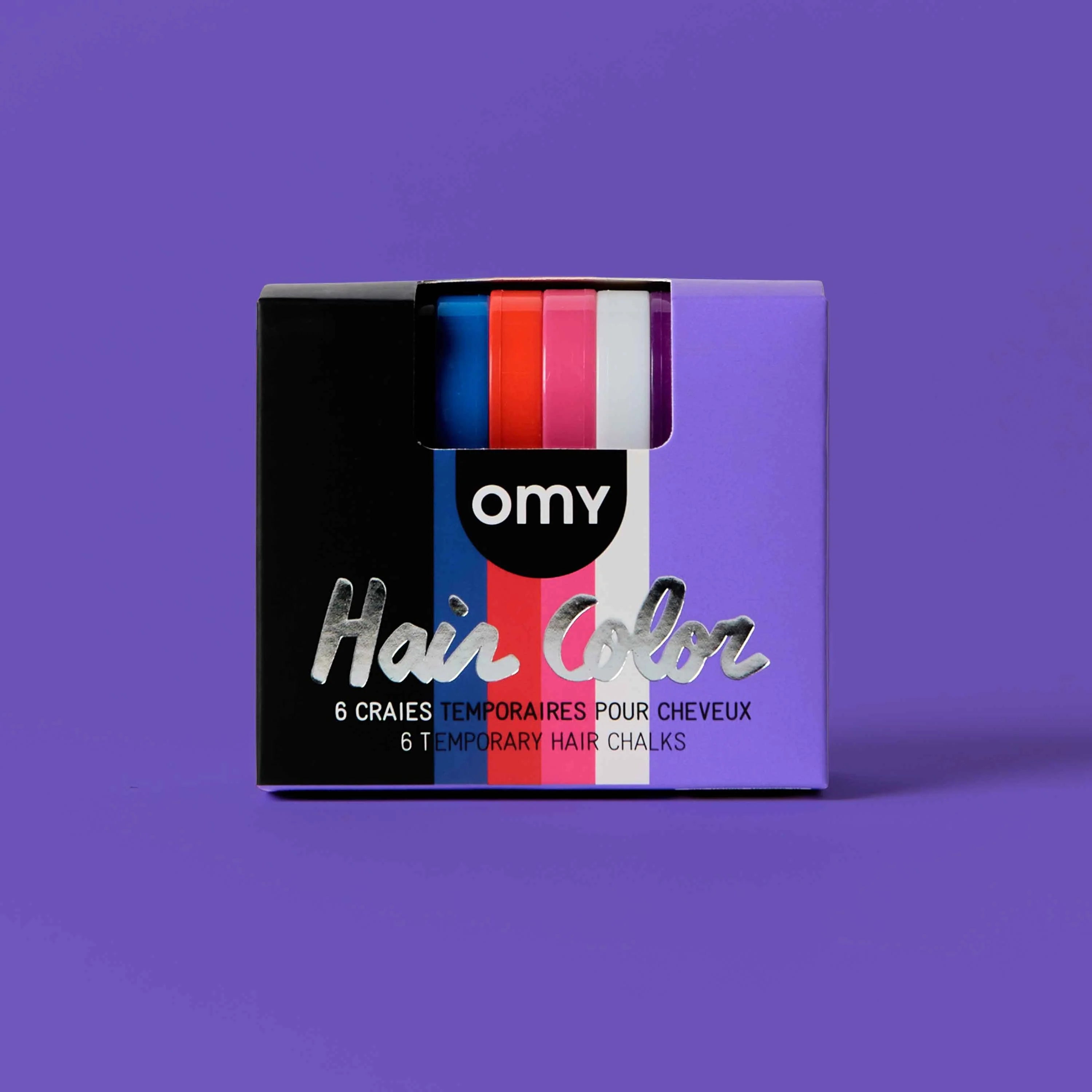 Coffret Hair Color Wicked OMY de 6 craies temporaires pour cheveux, noir, bleu, rouge, rose, blanc et violet, sur fond violet