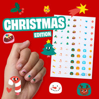 Stickers para uñas OMY edición navideña presentados en una lámina y aplicados en las uñas.