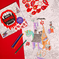 Poster à colorier Vampire OMY étalé au sol avec stickers et crayons