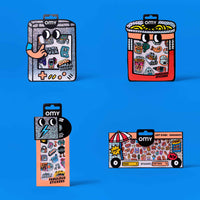 Four packages of OMY stickers on a blue background