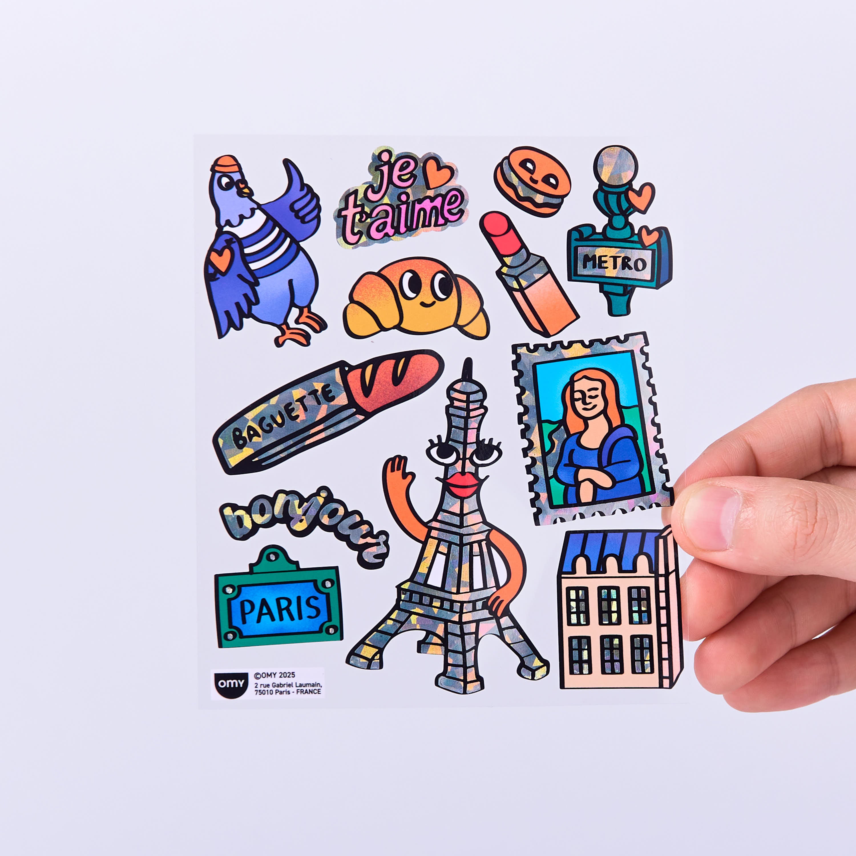 Planche de stickers Paris fluorescents et holographiques avec Tour Eiffel illustrée, baguette, Mona Lisa, métro, pigeon parisien et symboles emblématiques de Paris.