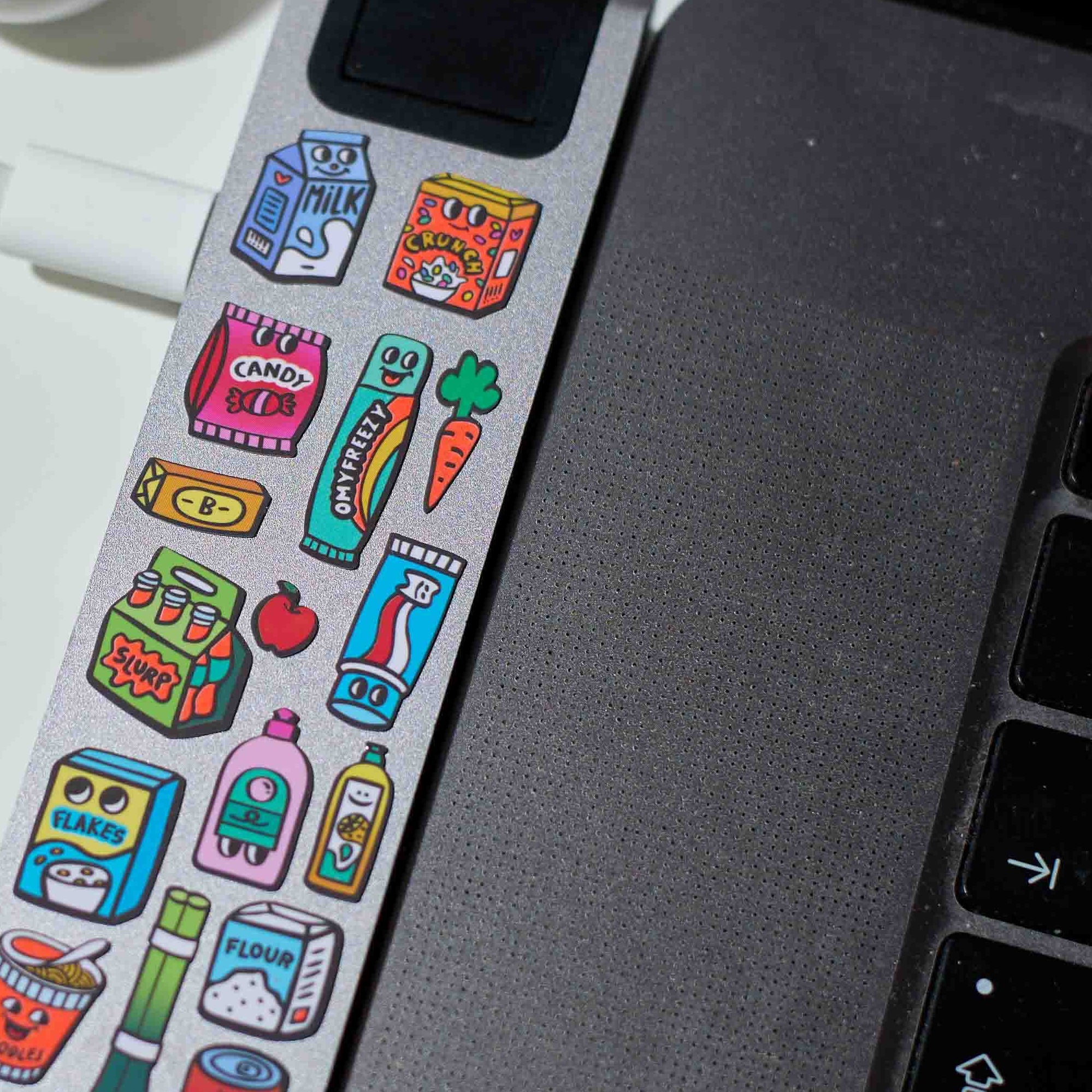 Supermarket OMY stickers applied to a computer, illustrations of colorful food products