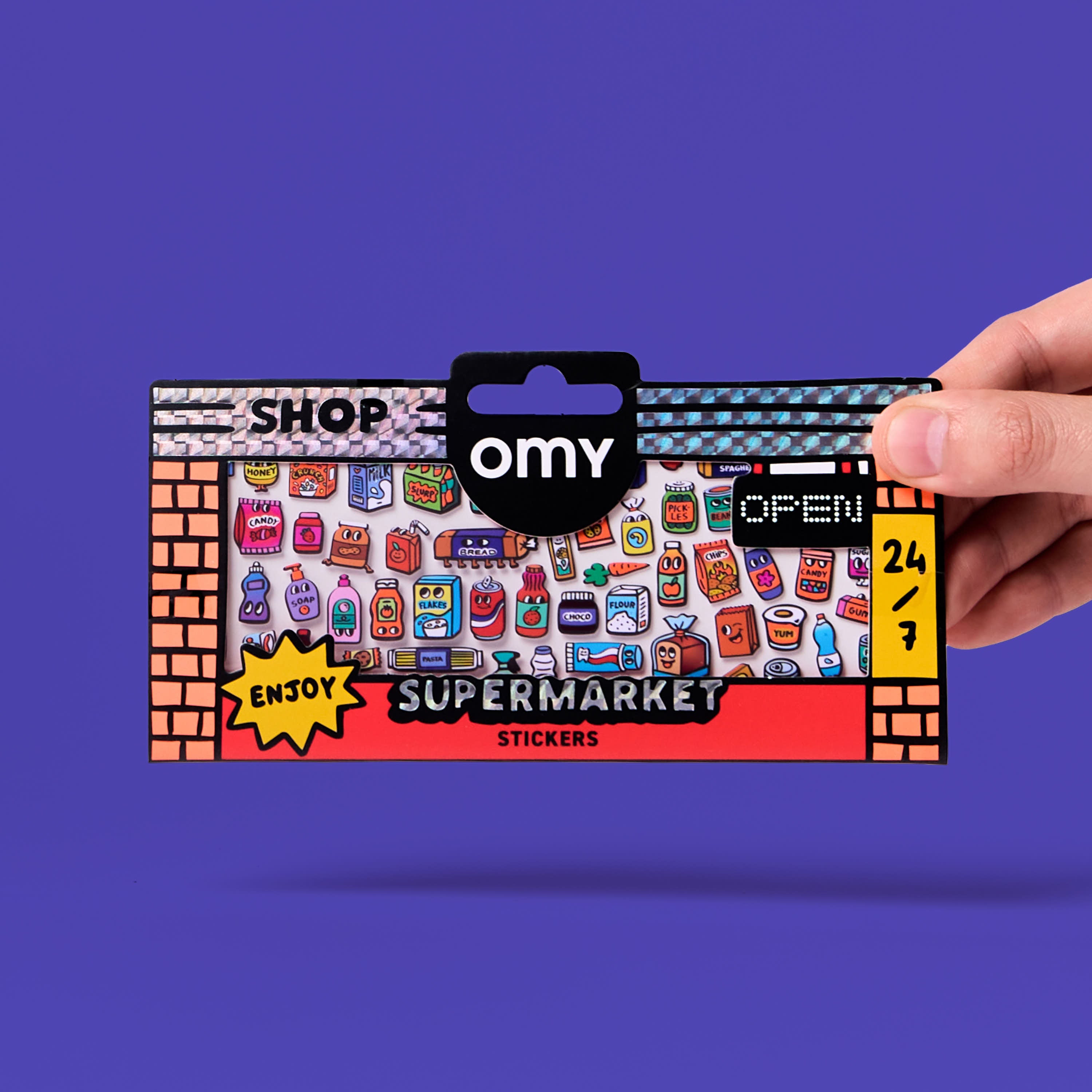 Fabulous Stickers Supermarket OMY packaging held in hand, vinyl sticker sheet on a supermarket theme