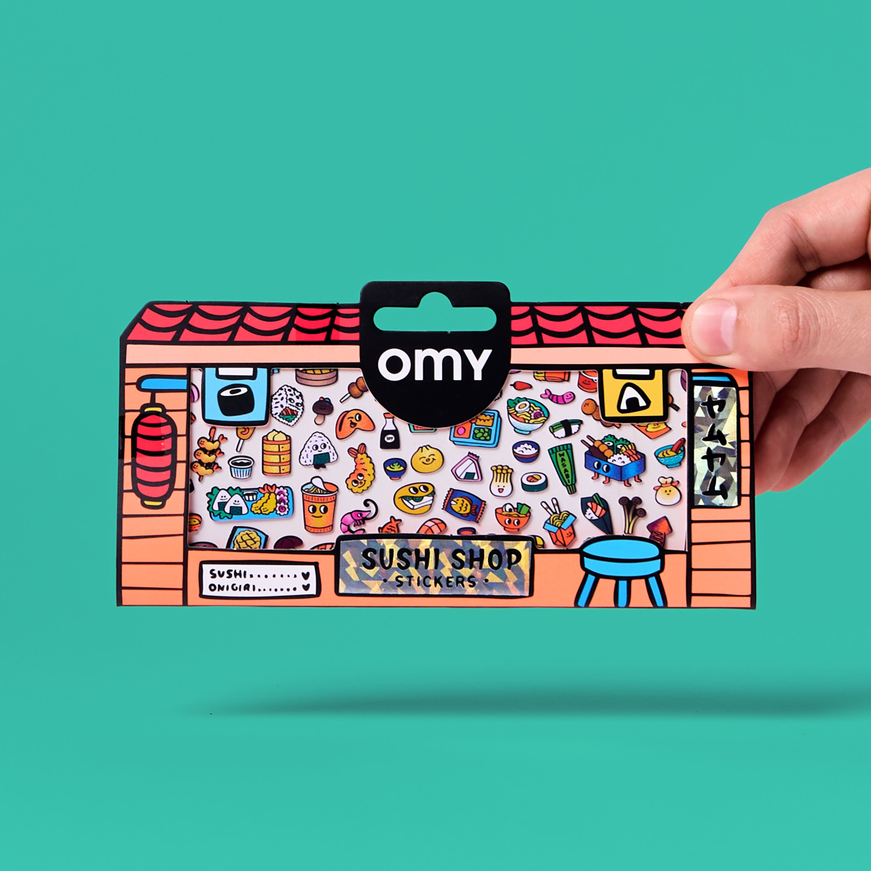 Sushi Shop OMY vinyl sticker sheet, fluorescent, illustrated packaging held in hand