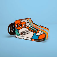 Sticker by Number Street OMY book shaped like a sneaker: 10 cards and 200 stickers, ages 6 and up, on a blue background.