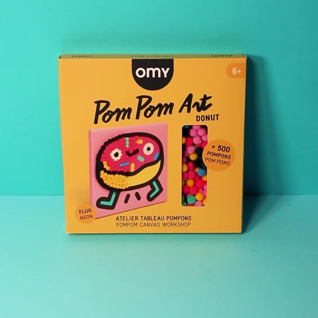 Vidéo du coffret Pom Pom Art Donut OMY, atelier tableau pompons avec plus de 500 pompons fluo, dès 6 ans